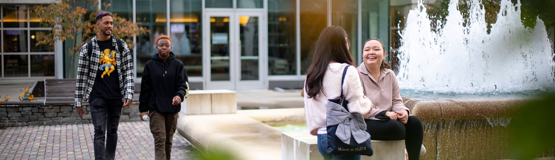 Students gather around a common area on the UAlbany campus