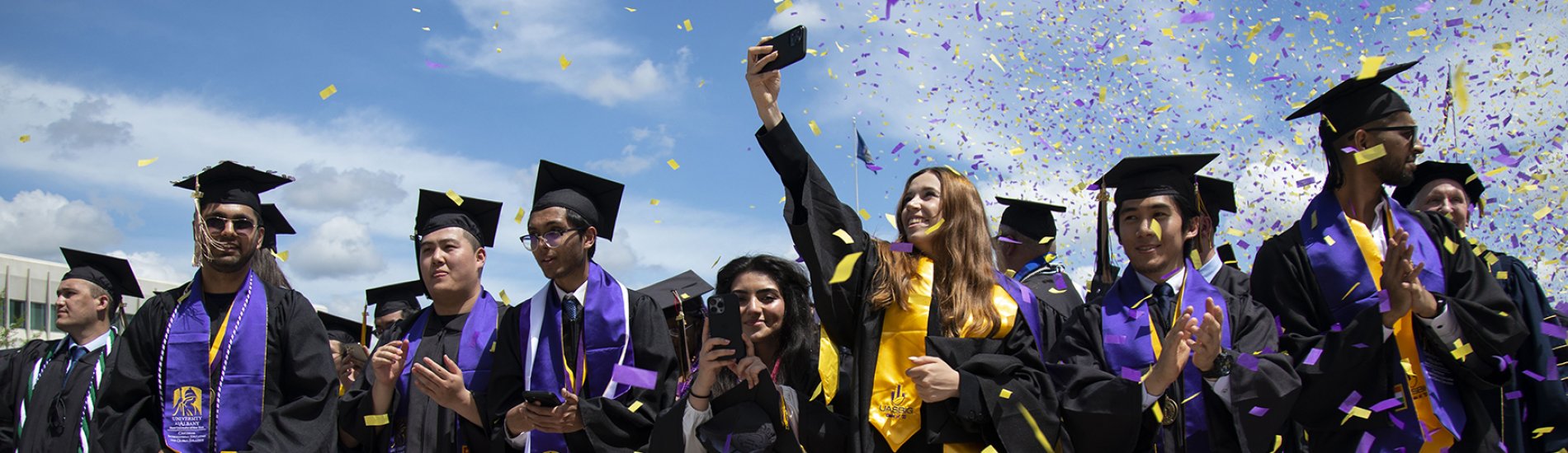 Students taking pictures at commencement.