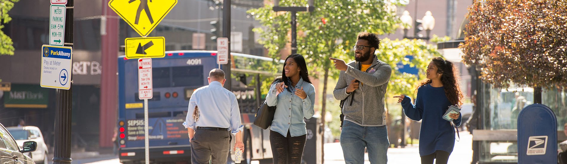 A group of students walking in downtown Albany, New York.