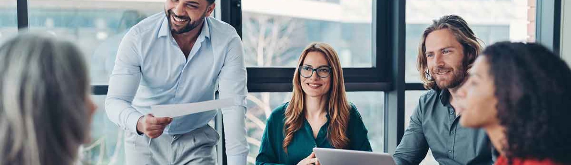 A team leader conducts a meeting in a conference room.