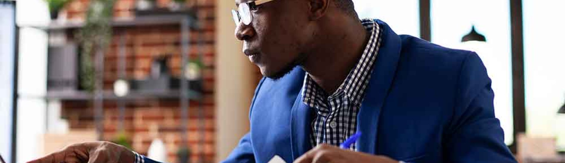 A research associate at his desk reviews data from a psychological study.