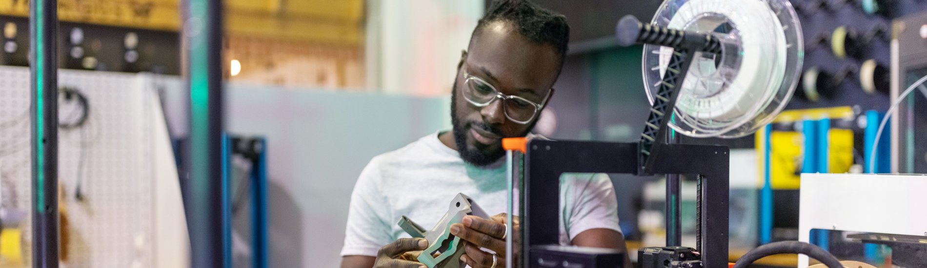 A student working with equipment in an engineering lab.
