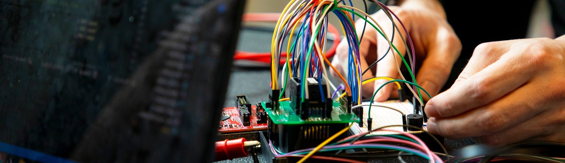 A student working on a circuit device.