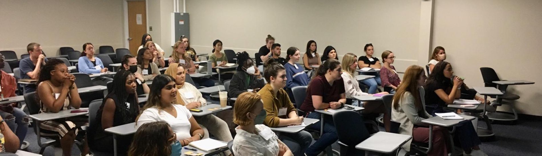 Students gathered in a classroom for the Global Health Fall Seminar Series