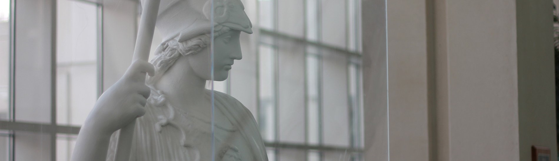 A white plaster statue of Minerva, the Roman goddess of wisdom