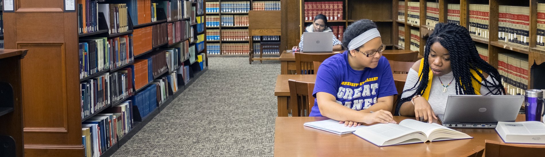 Students studying in the Dewey Library.