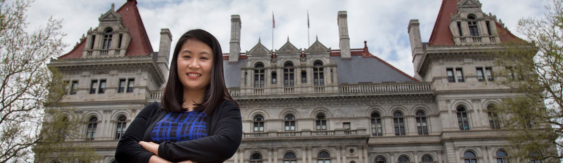 Doctoral student Sora Park in front of the New York State Capitol Building.
