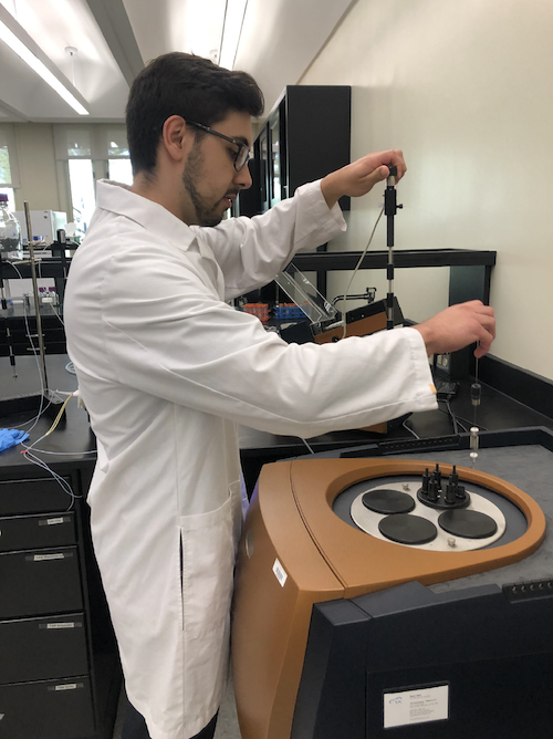 UAlbany undergraduate student Anthony Testo (Chem Undergrad) measuring enzyme activity using a highly sensitive microcalorimeter system.
