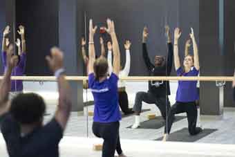 A group of students participate in a wellness class