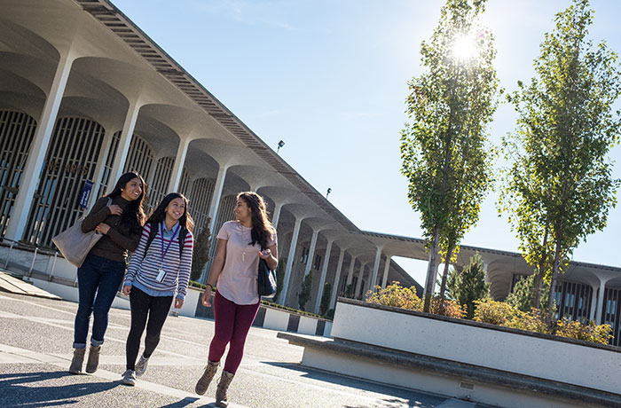 Three students walking UAlbany uptown campus