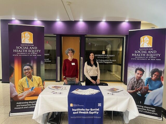 Two ISHE individuals at the UAlbany showcase.