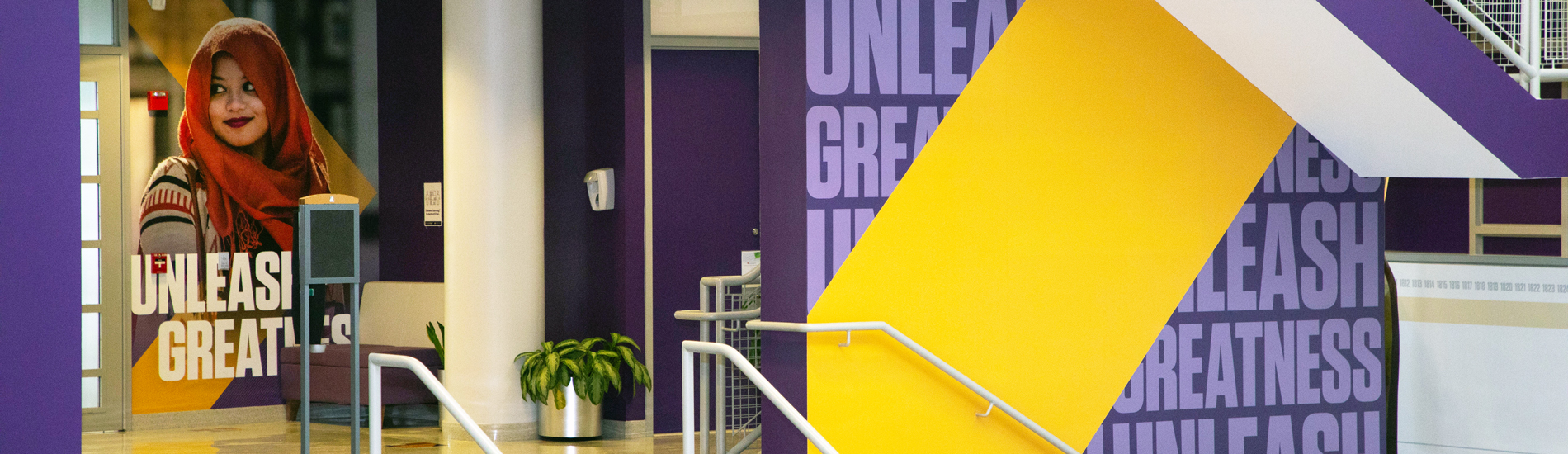 Environmental graphics in University Hall displaying the Unleash Greatness Brand.