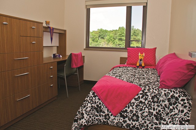 Notre Dame furnished dorm room with bedding and desk