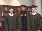 Monte Lipman '86, UAlbany President Robert J. Jones and Avery Lipman '88 are robed and ready for commencement to begin.