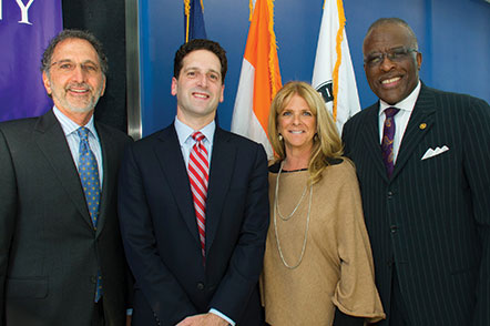 Norm and Micki Massry pose for a picture with Inaugural Lecturer Benjamin Lawsky and Dr. Jones