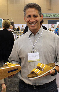 David Kahan shows off yellow Birkenstock sandles