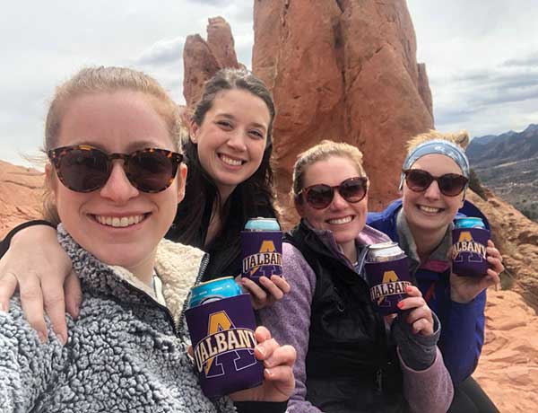 UAlbany grads show off UAlbany gear in Denver