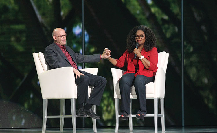 Mark Nepo and Oprah Winfrey on stage during The Life You Want Tour