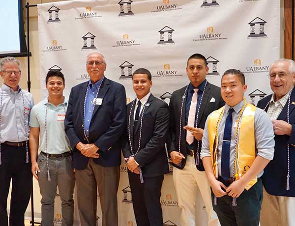 Fraternity and sorority alumni at UAlbany cording ceremony