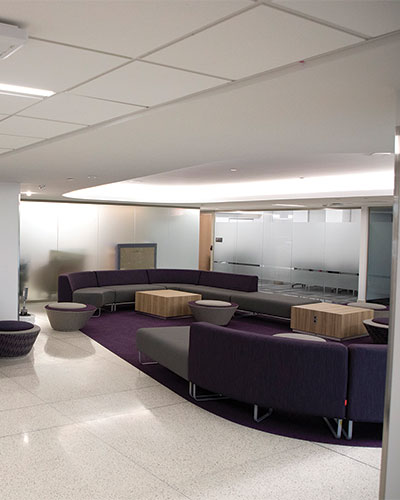 Lounge with couches in the renovated former School of Business building.