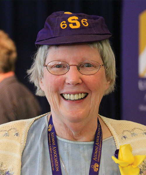Alumna in purple beanie.