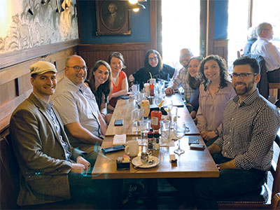 Alumni at long table in restaurant in D.C.
