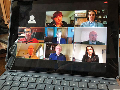 A computer screen with a Zoom session and nine participants.