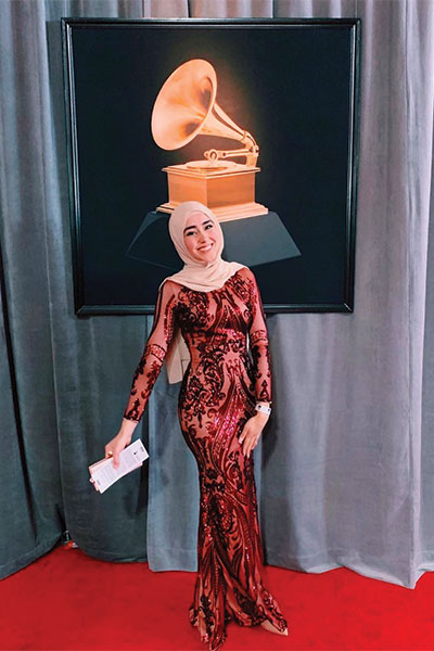 Hashimee poses for a picture on the red carpet at the Grammy Awards.