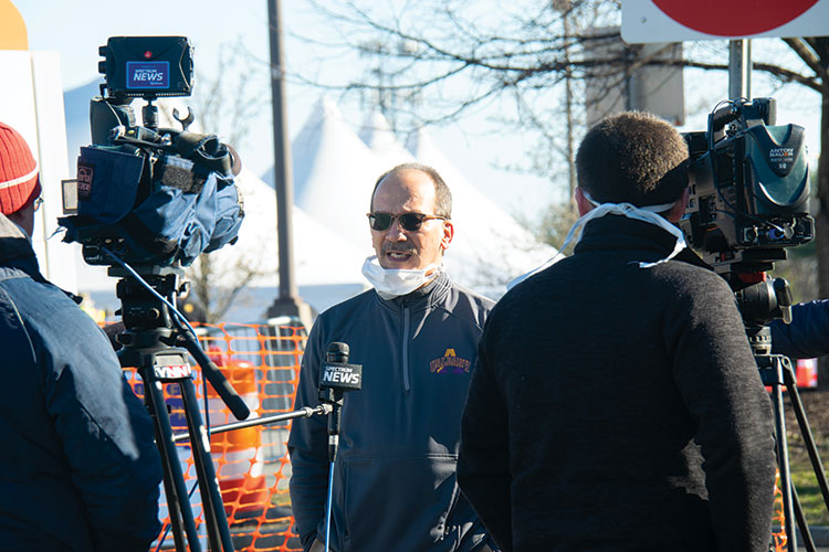 President Rodriguez talks to a media crew.