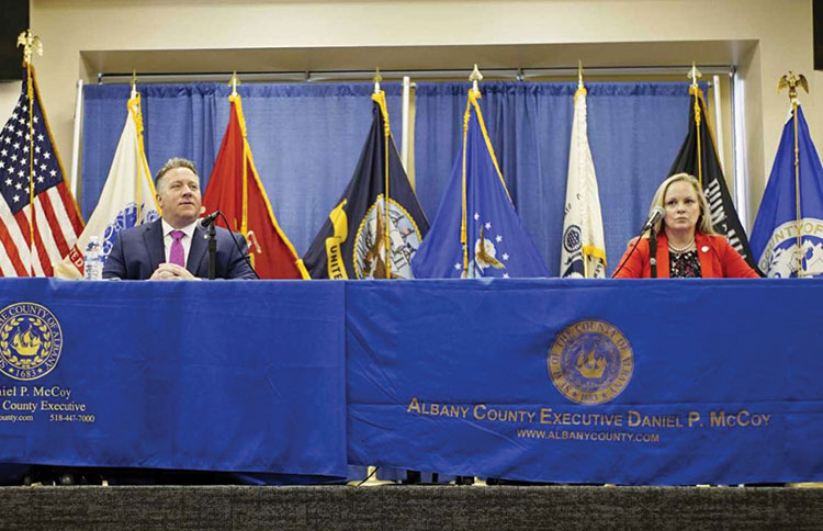 Whalen speaks at a press conference.