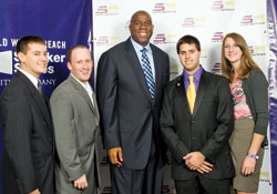 Student Association leaders pose with Magic Johnson