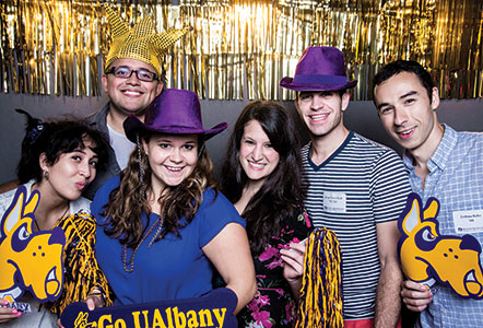 GOLD alumns pose for a picture at the GOLD Schmooze in NYC