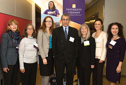 Event host Joan Rosenthal poses with alumni, School of Business Dean and featured speaker at Women in Accounting networking event