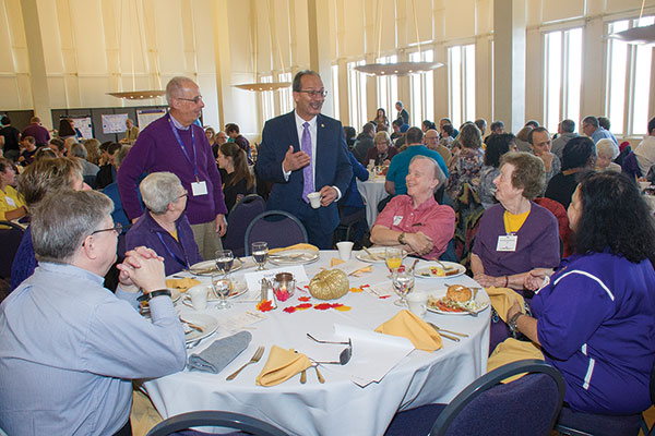 President Rodriguez talks to members of the Class of 1952 at the President's Breakfast