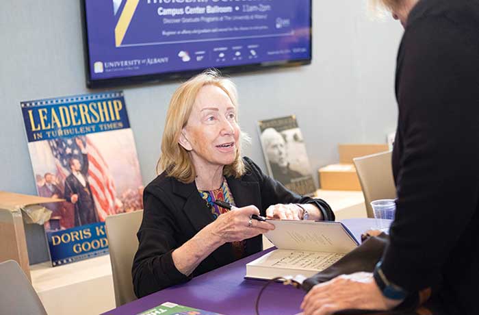 Doris Kearns Goodwin, author of Leadership in Turbulent Times, signs her book.