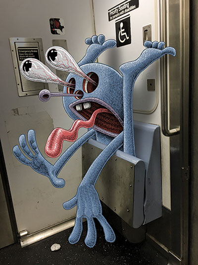 Blue monster with bulging eyes stuck in a folding seat in the handicap section of the subway car
