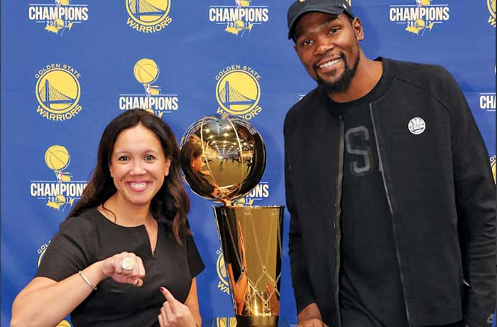 Gracie Mercado poses for a photo after the Golden State Warriors win the championship