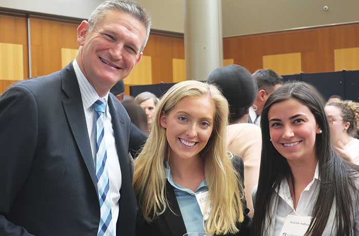UAlbany alumni pose for a photo