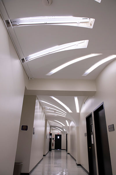 Hallway lit by palm lights.
