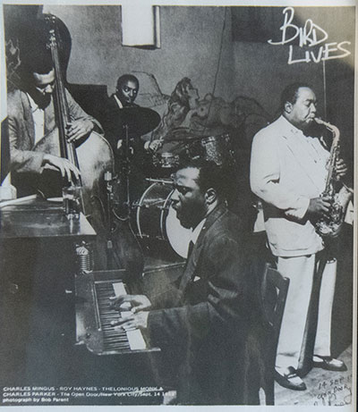 Black and white photo of jazz musicians playing saxaphone and other instruments