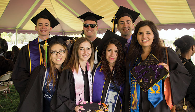 Friends celebrate together at undergraduate commencement ceremony