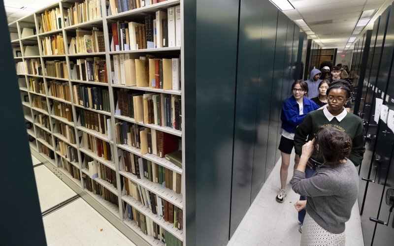 Melissa McMullen, Research Services Archivist at University Libraries, leads a group of First Year Experience students on a tour through the M. E. Grenander Department of Special Collections & Archives last week.